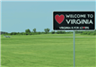 Welcome to Virginia Sign in Front of Airfield