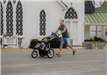 Father Running with His Son in a Stroller in the Second Chance Mission Run 5k